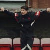 Barry Keoghan stands in Manchester United kit