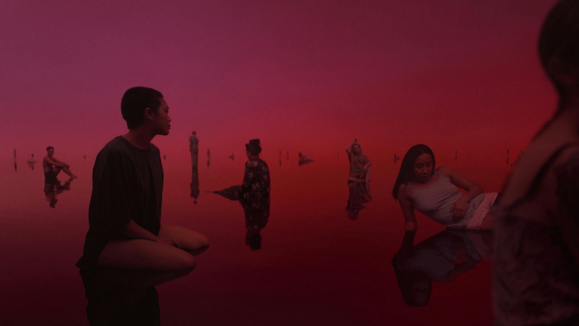 Still image of people dotted around a lake environment, as part of Libresse's Periodsomnia ad