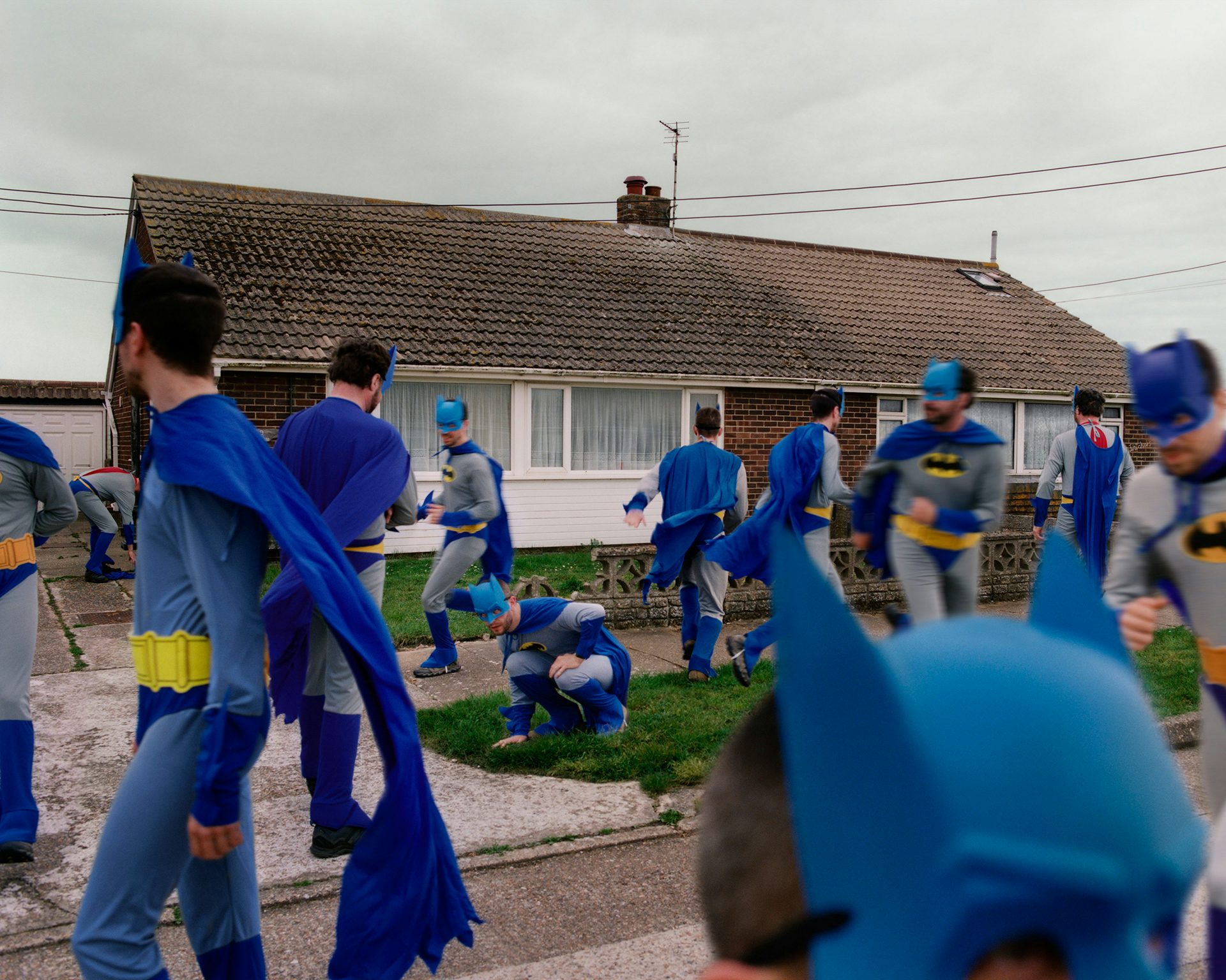 Photograph of a group of cosplayers dressed as Batman in Kids of Cosplay by Thurstan Redding